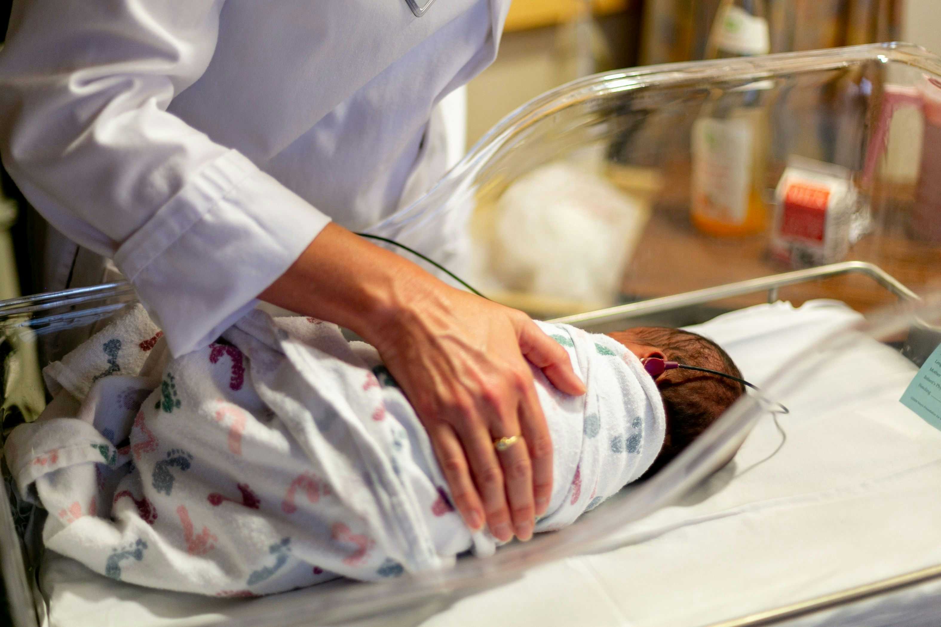 Nurse with newborn baby