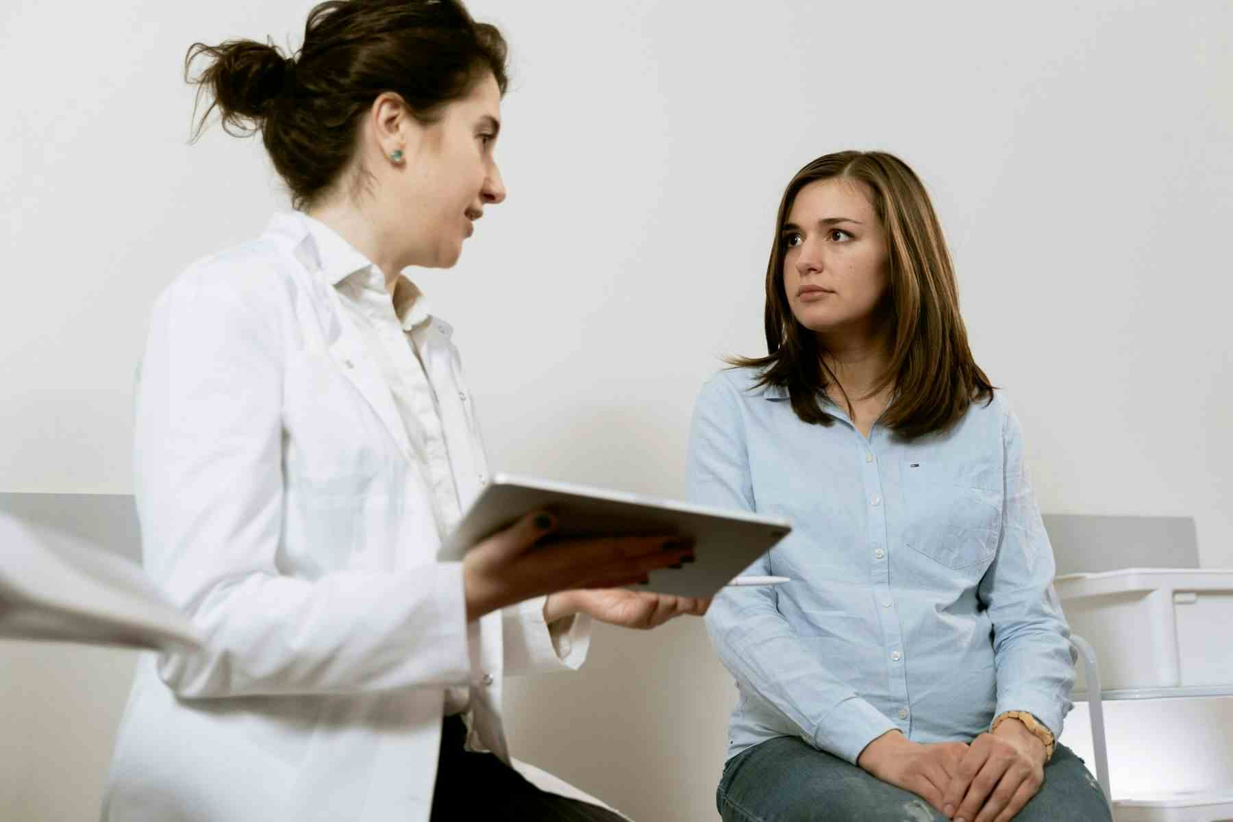 Doctor talking with female patient