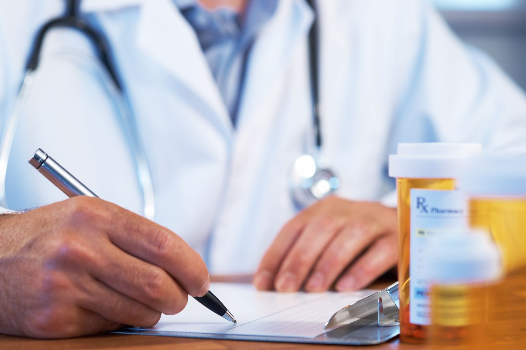 Doctor writing prescription