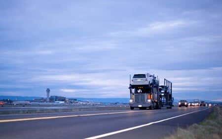 Car Slides Off Carrier Trailer Causing Highway Accident