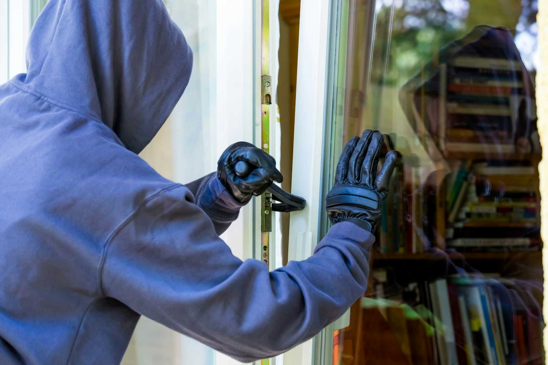 Burglar breaking into home