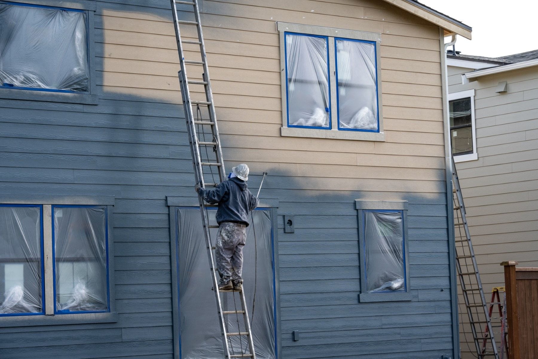 Man painting building