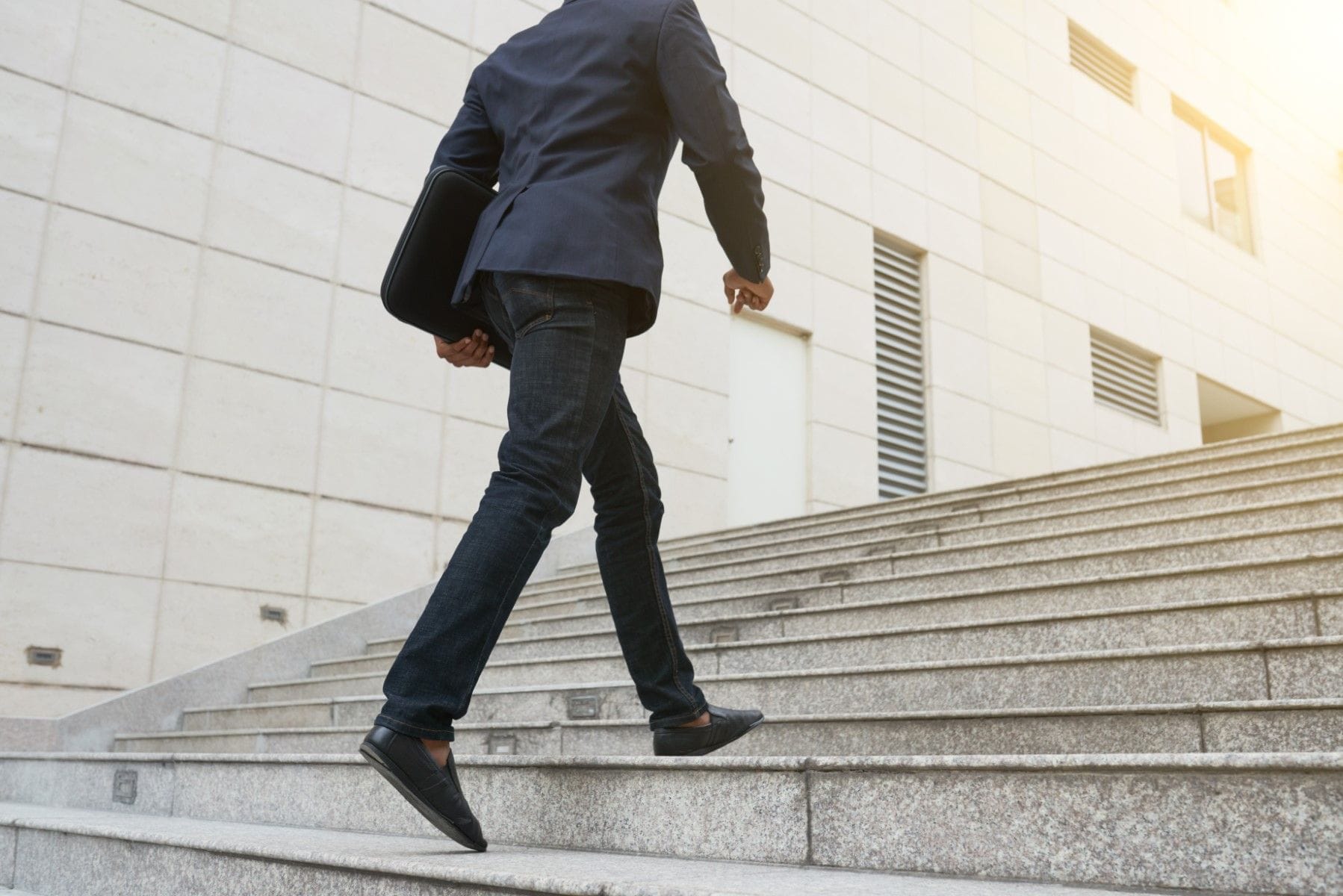Lawyer walking up stairs