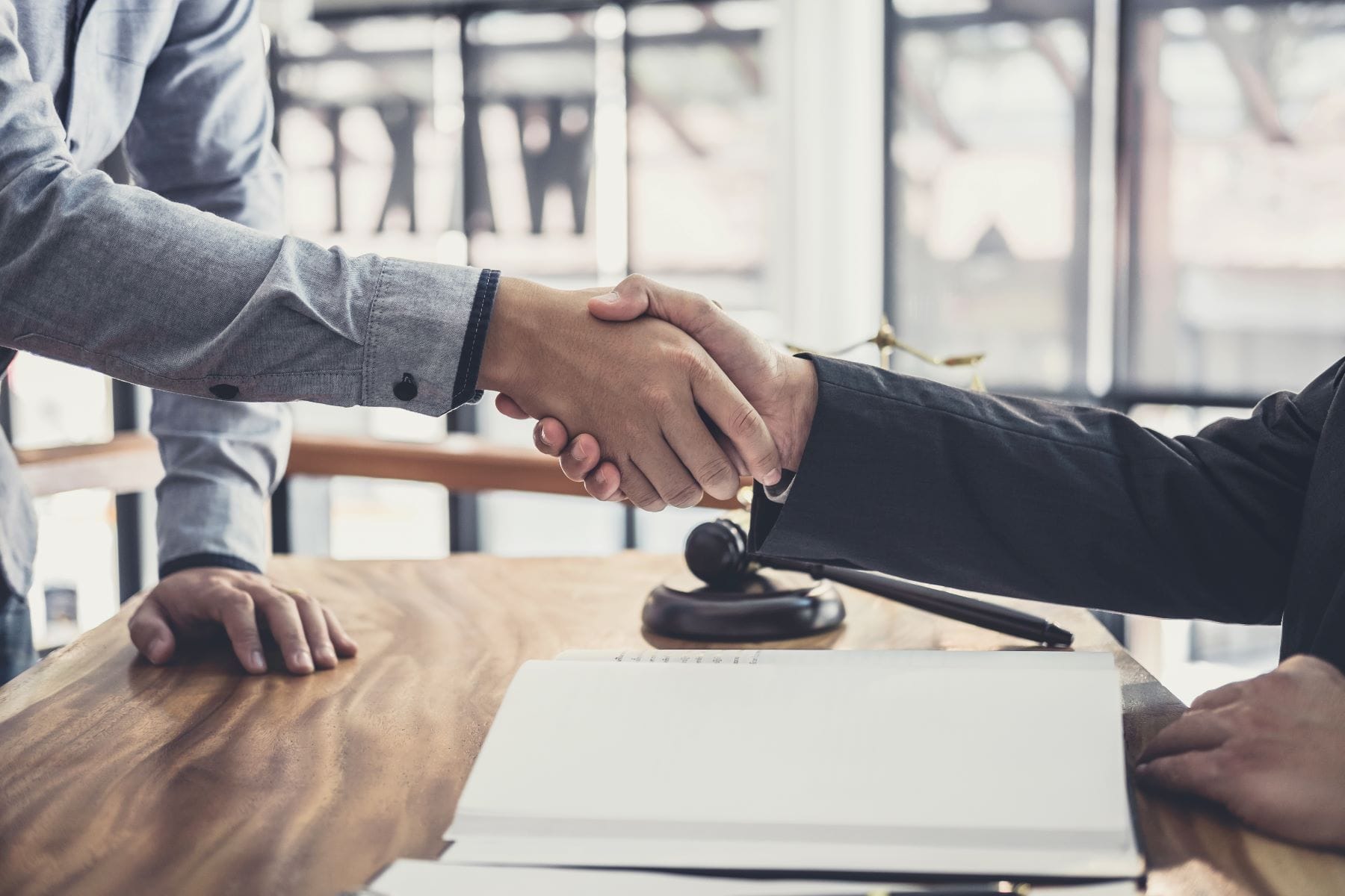 Attorney and client shaking hands