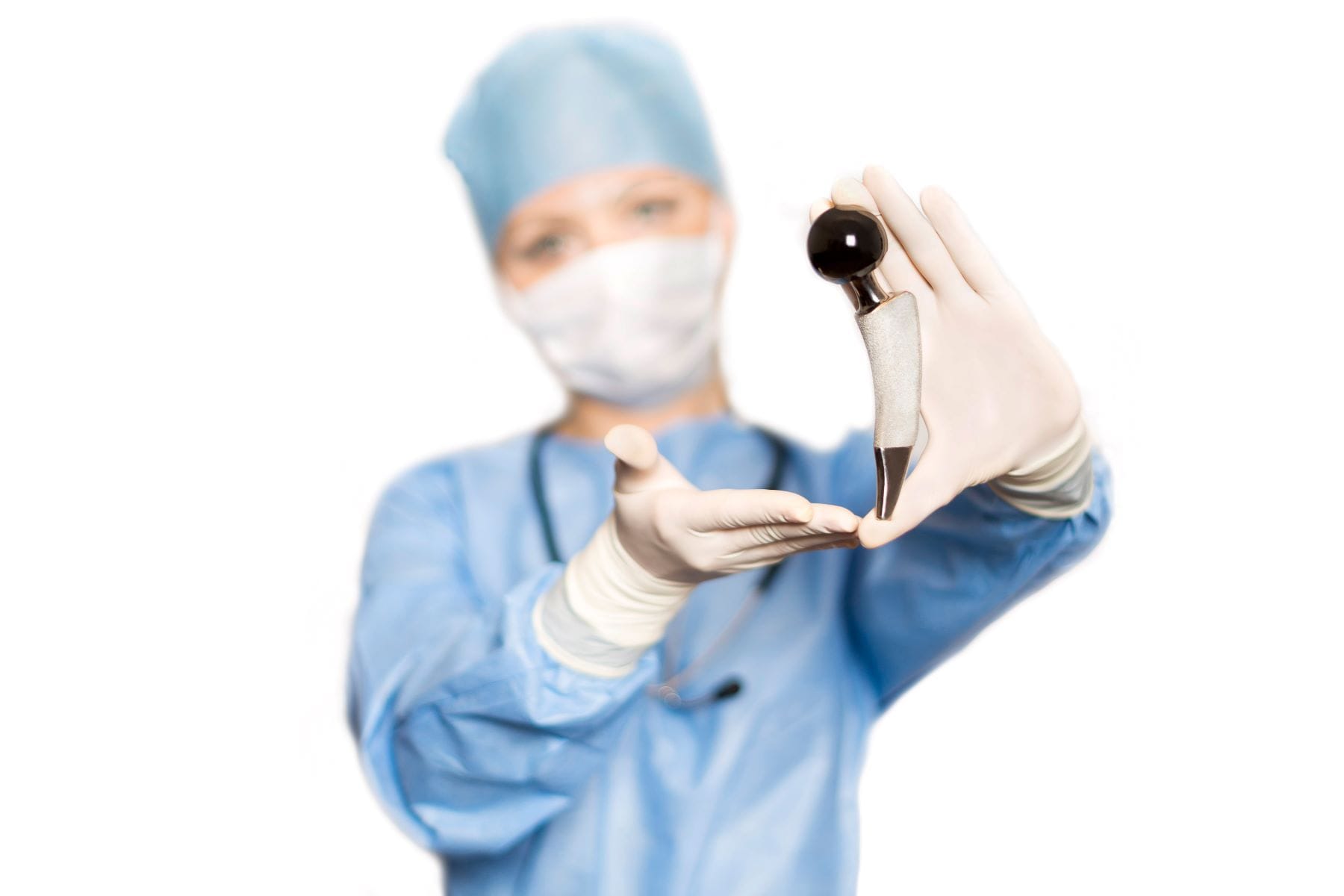 Doctor holding DePuy hip implant