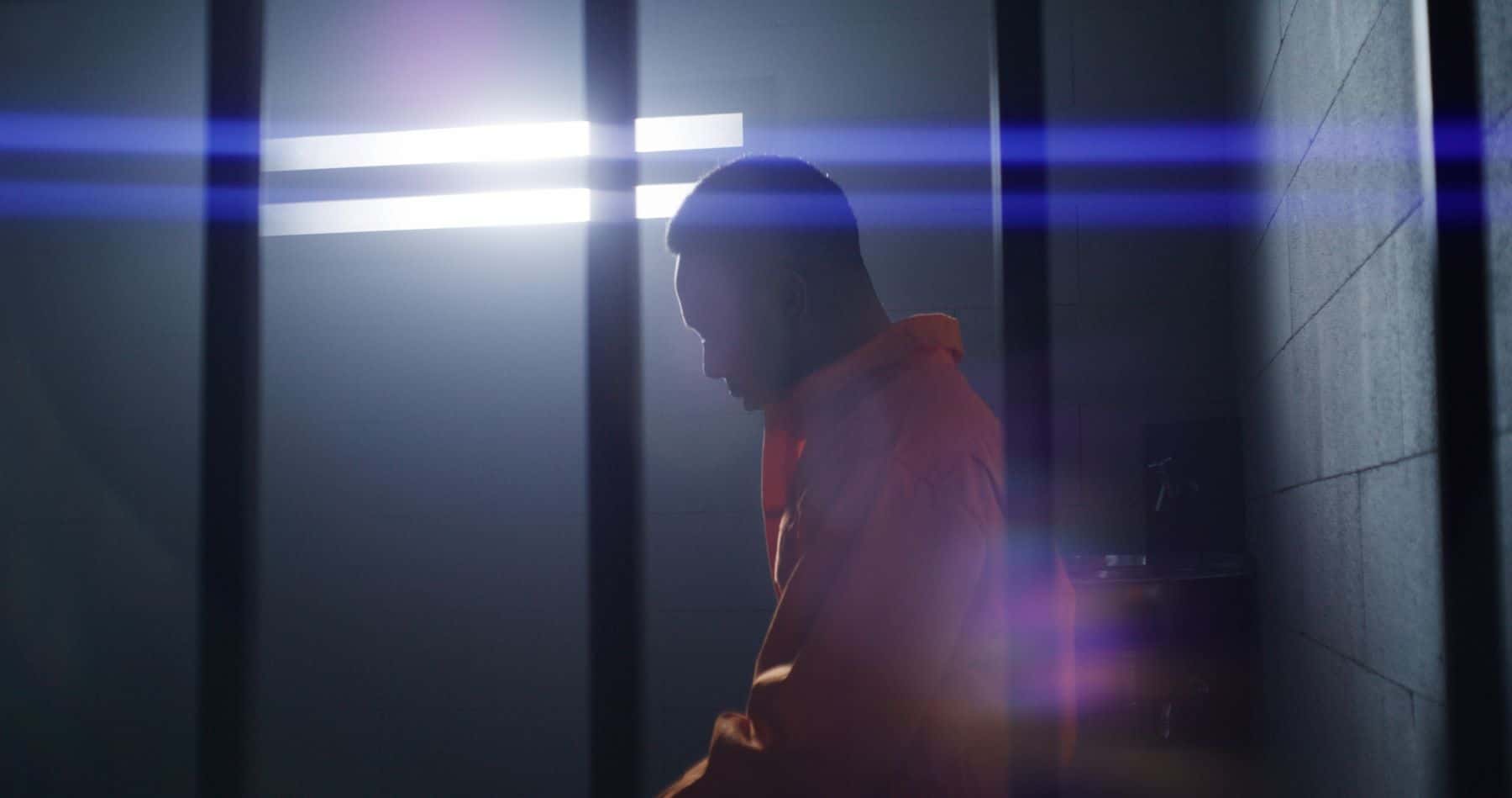 Depressed prisoner in cell