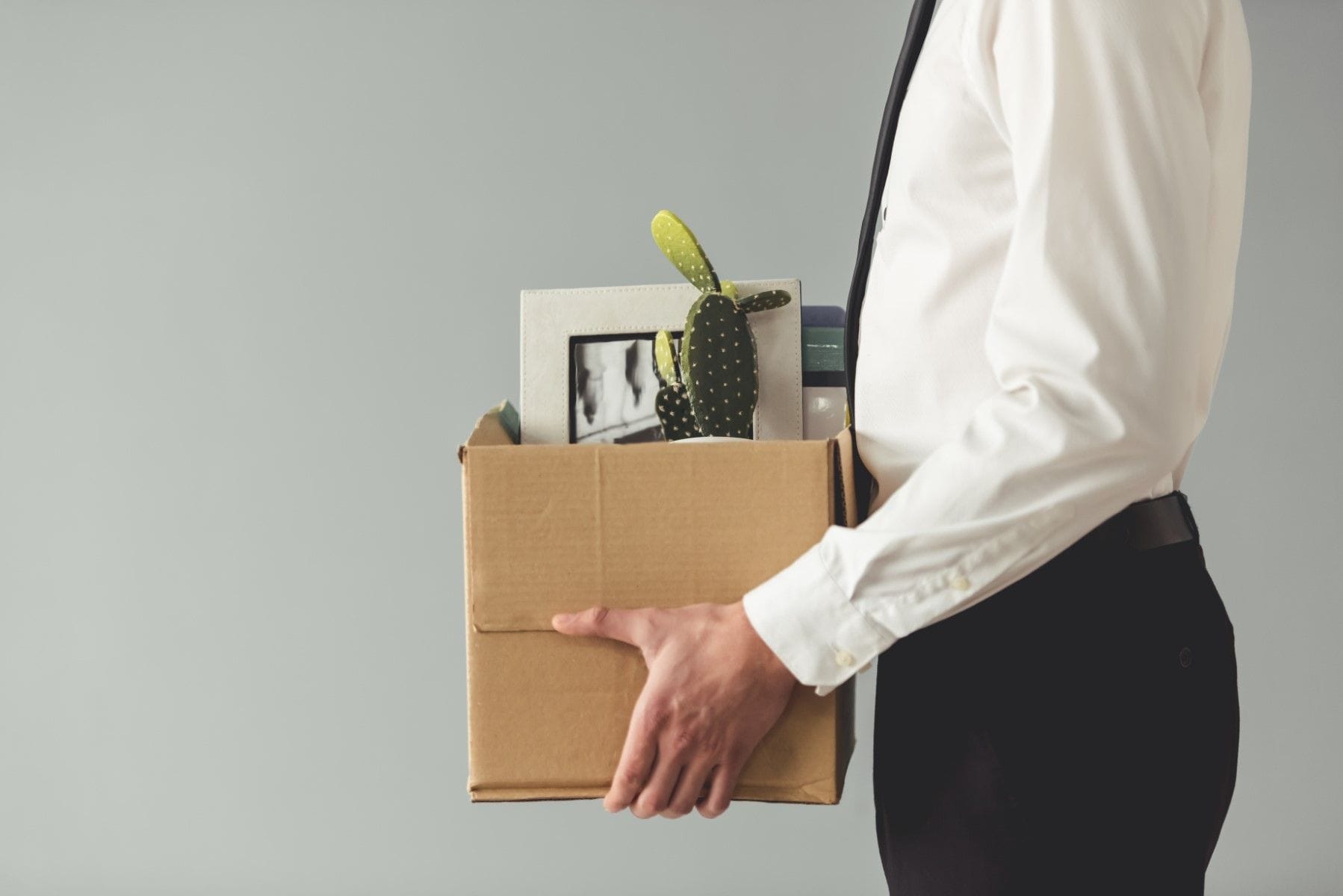 Person carrying box after termination