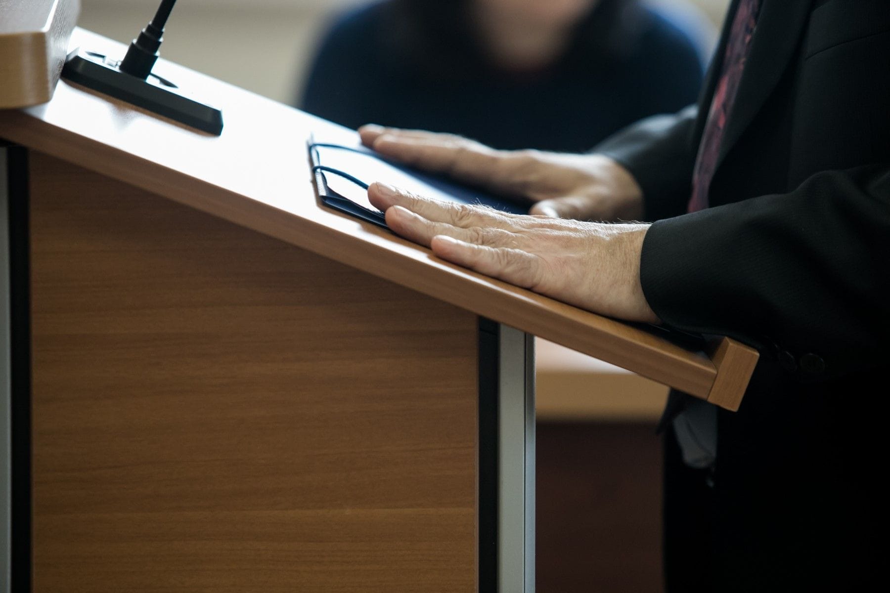 Expert witness speaking at podium