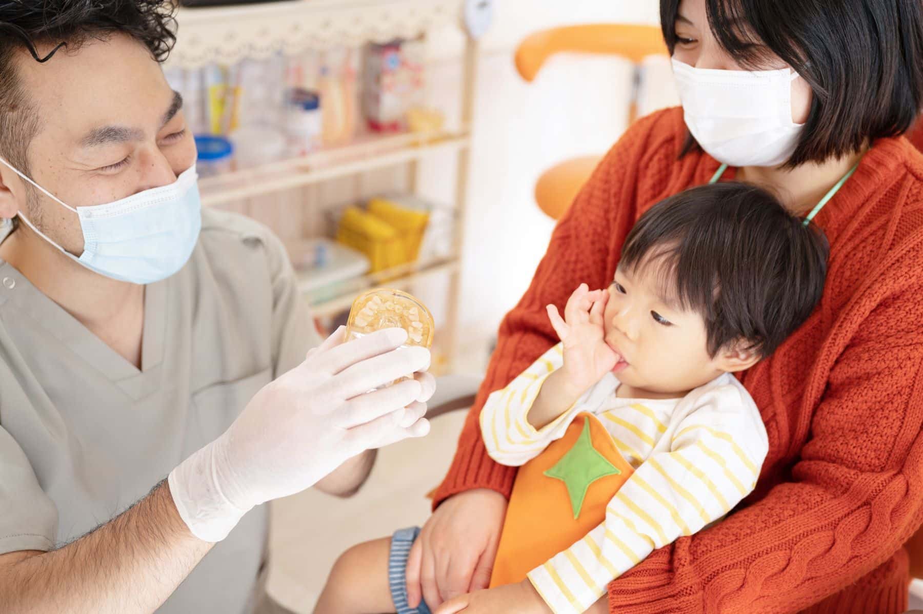Dentist with pediatric patient