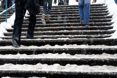 Slip and Fall on Icy Steps at Apartment Building; Code Violations Alleged
