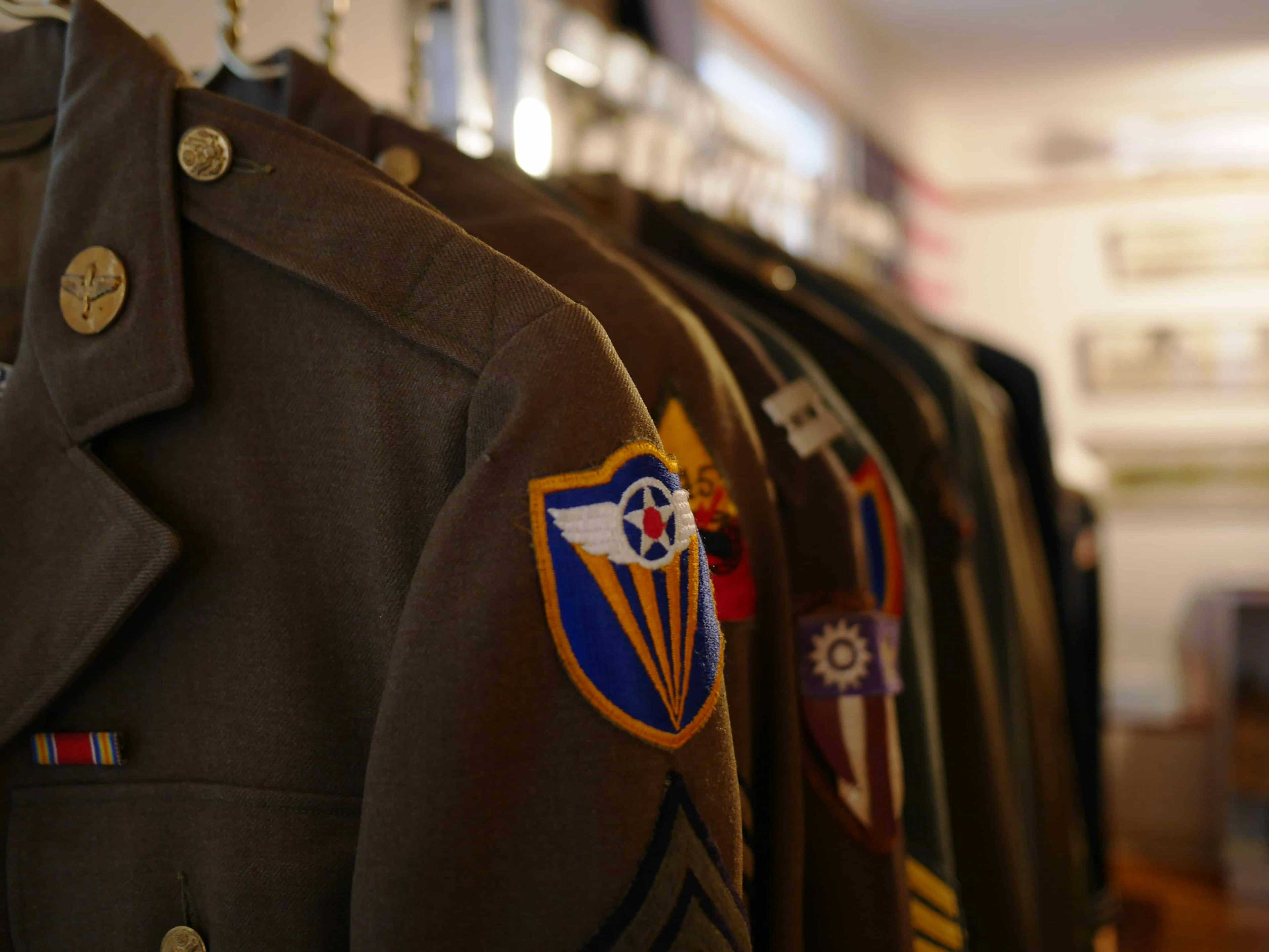 Military uniforms hanging