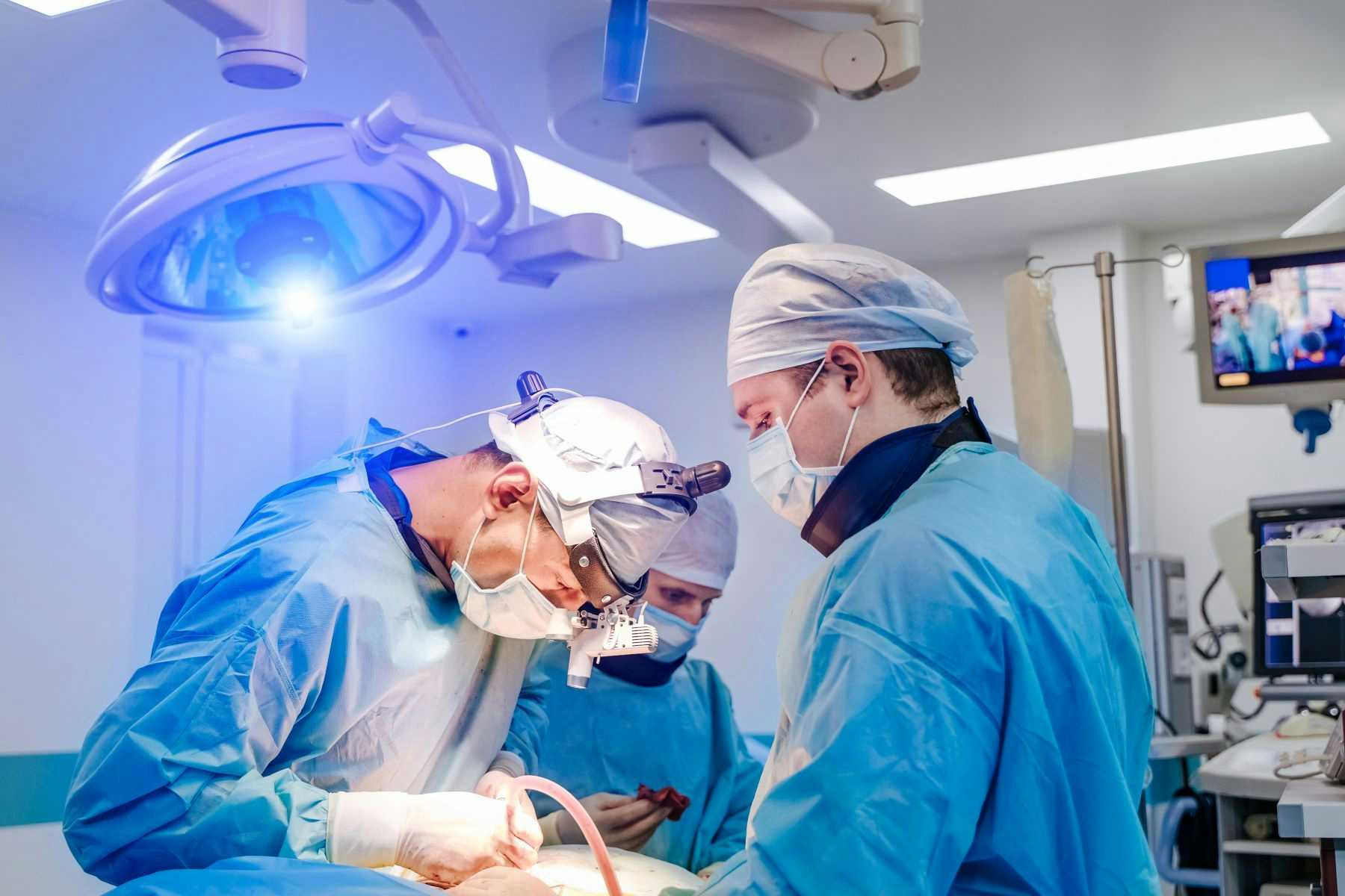 Spinal surgeons in operating room