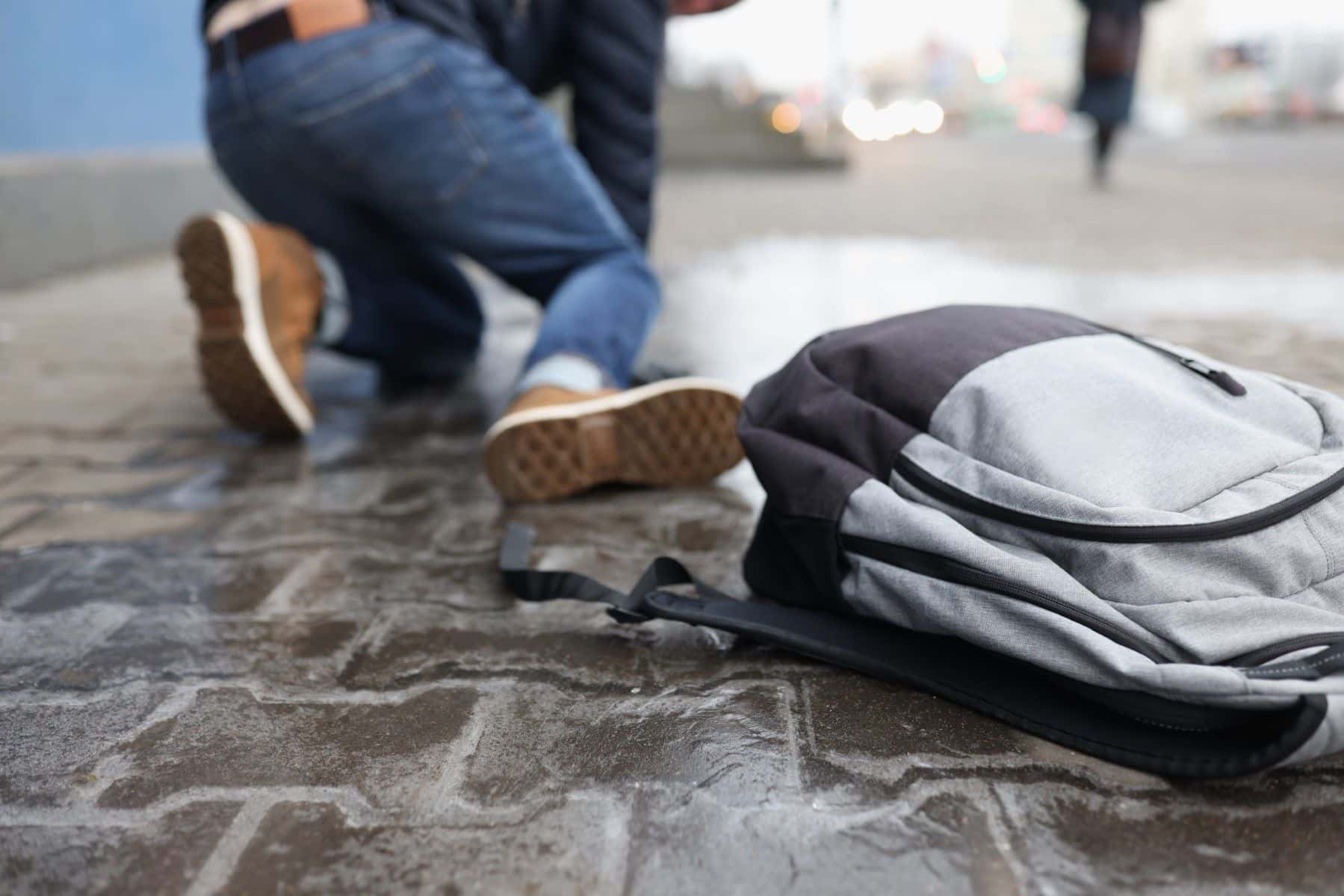 Individual slipping on sidewalk
