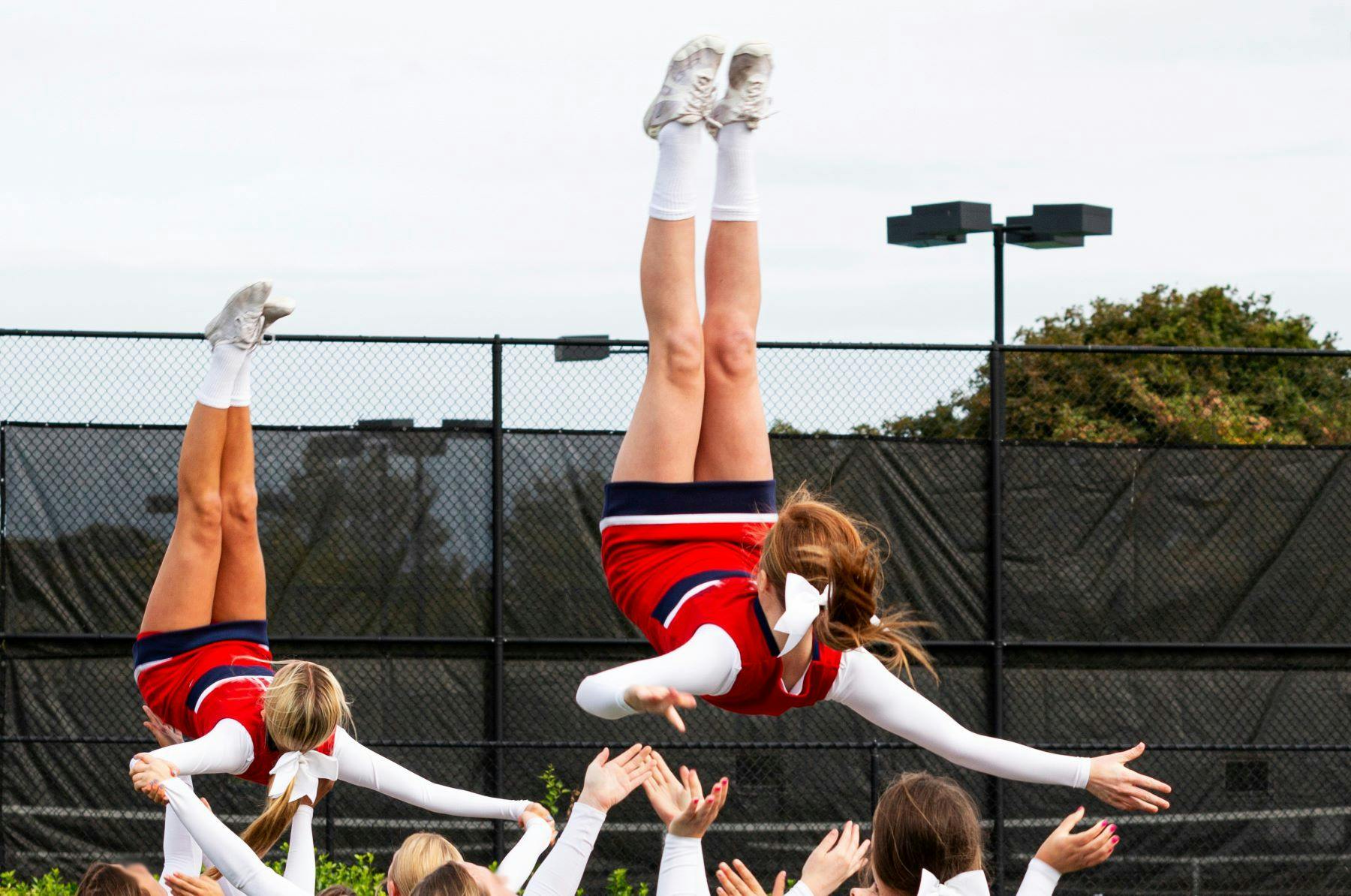 Cheerleaders performing stunt