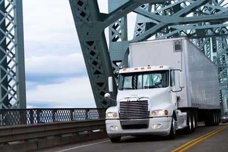 Tractor-Trailer Merges Into Lane Causing Accident