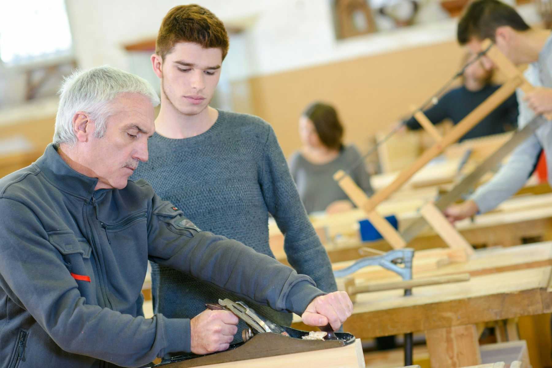 Teacher and student in shop class