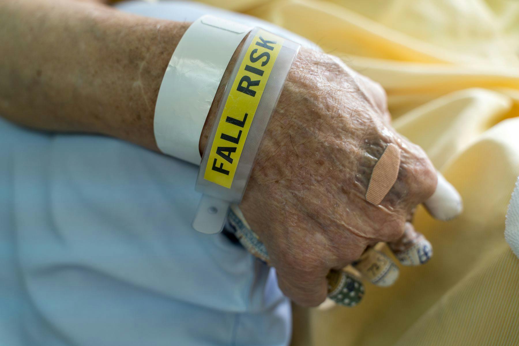 Patient wearing fall risk wristband