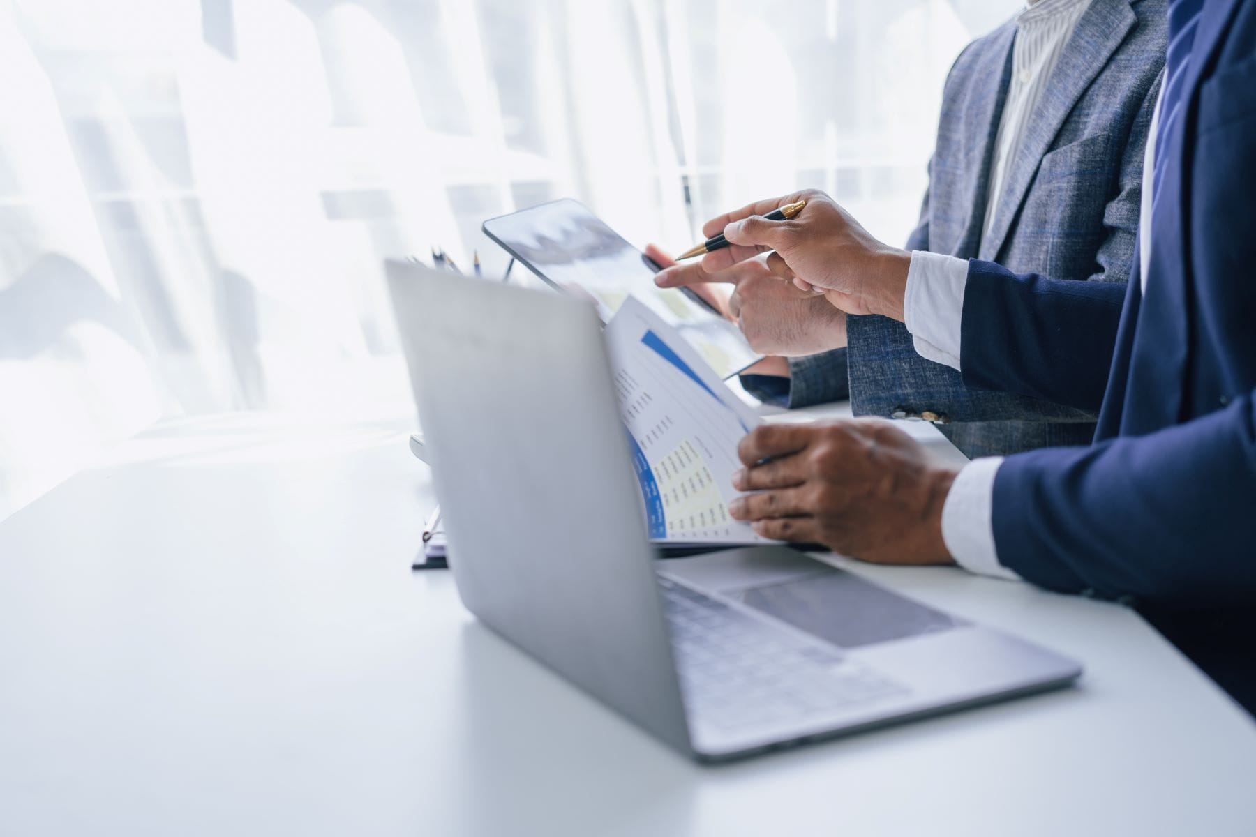 Two professionals reviewing documents