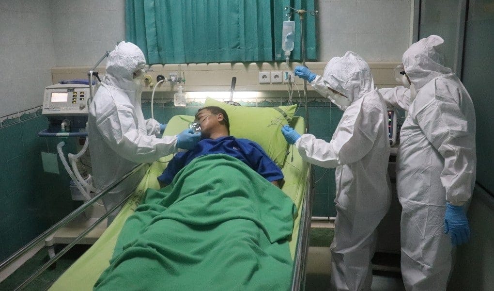man in hospital bed