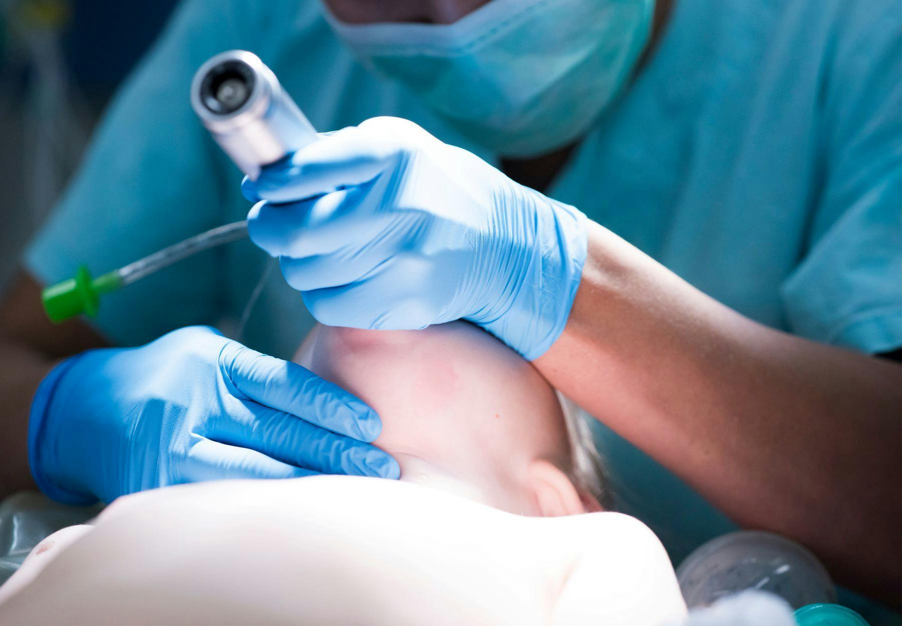 Anesthesiologist performs intubation