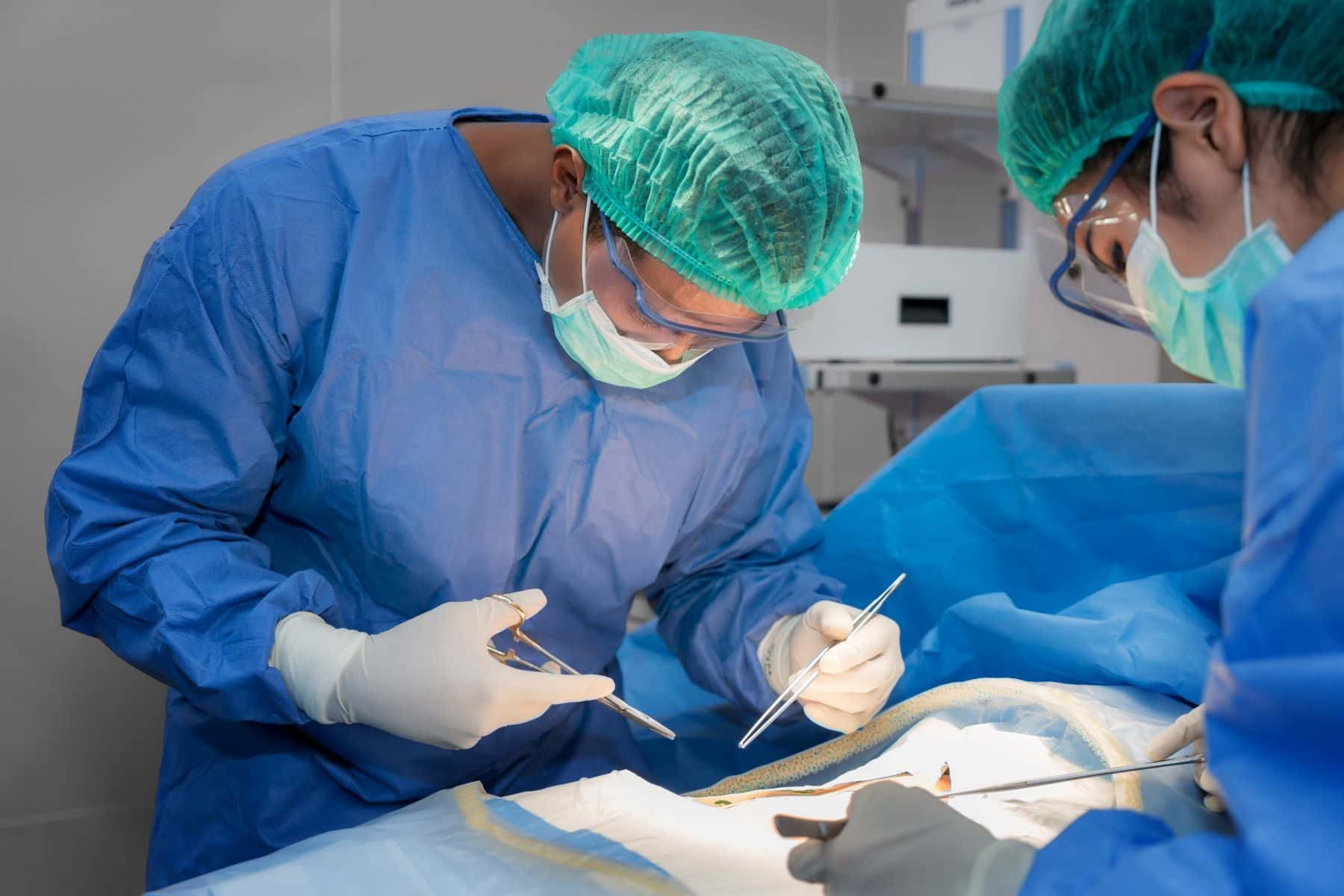 Surgeons operating on patient