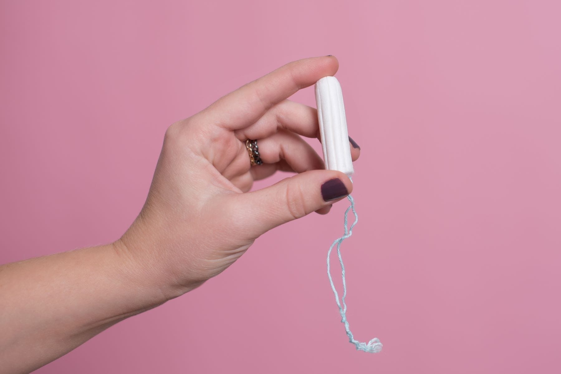 Woman's hand holding a tampon