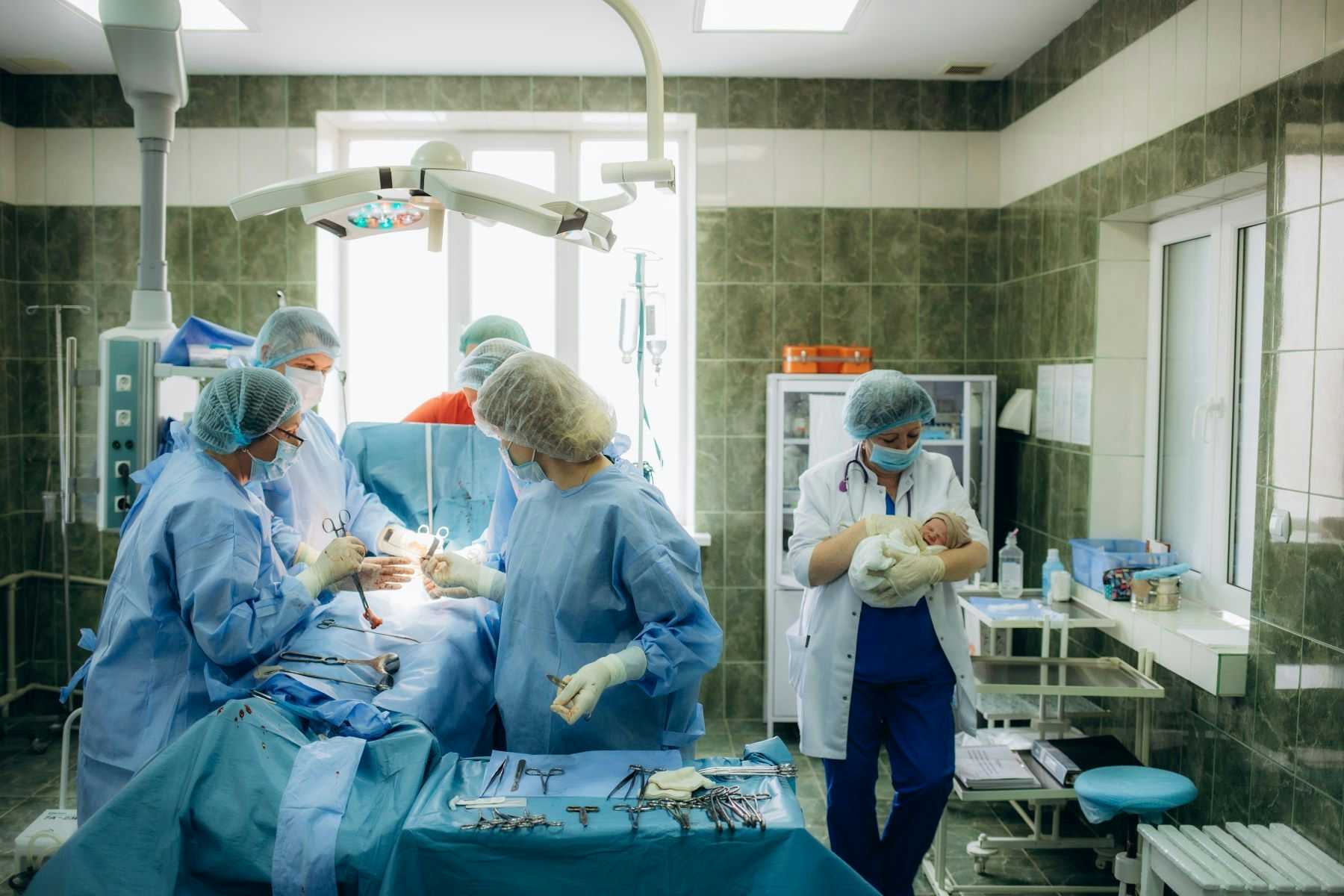 Surgeons performing c-section