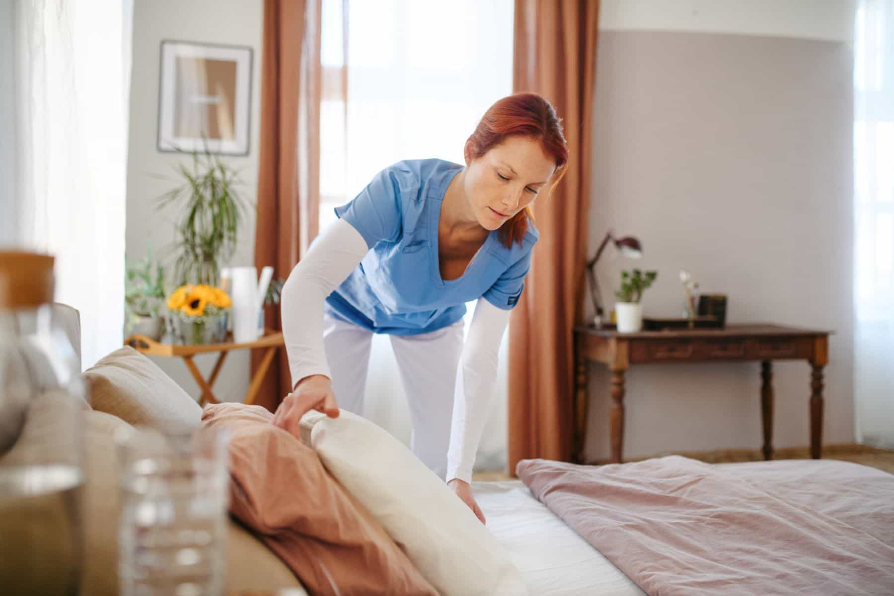 Nurse making bed