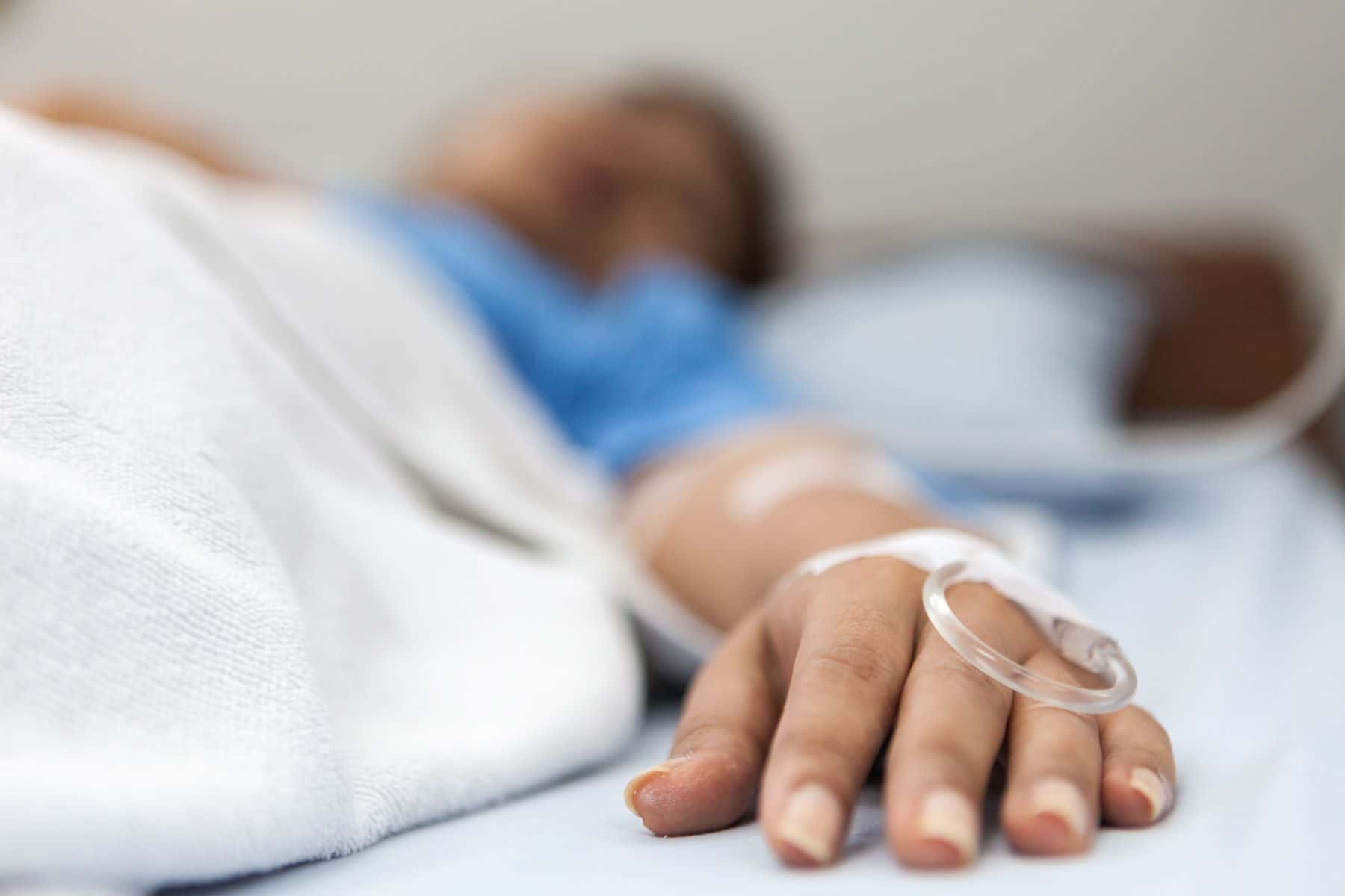 Patient laying in hospital bed