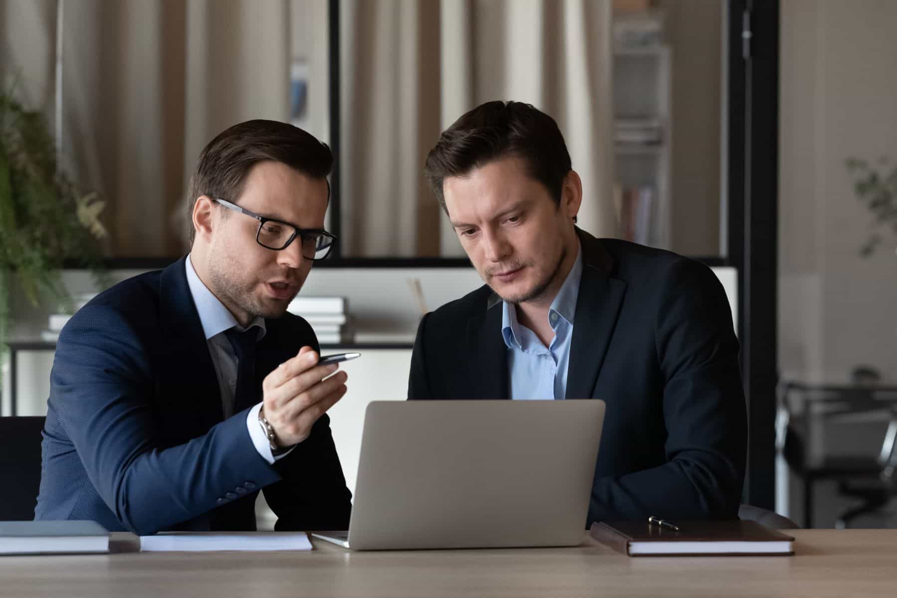 Attorneys looking at laptop screen