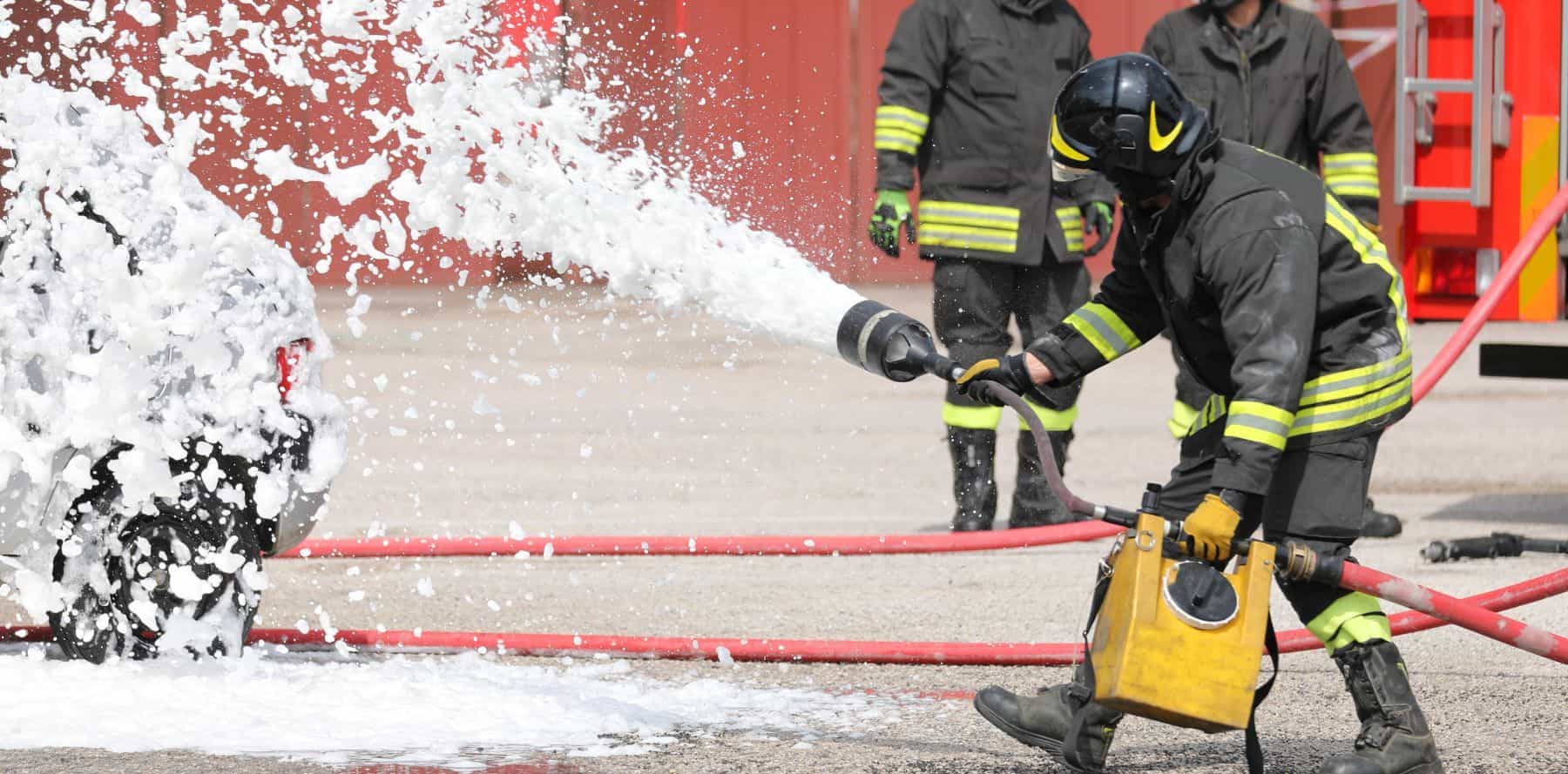 Firefighter using foam